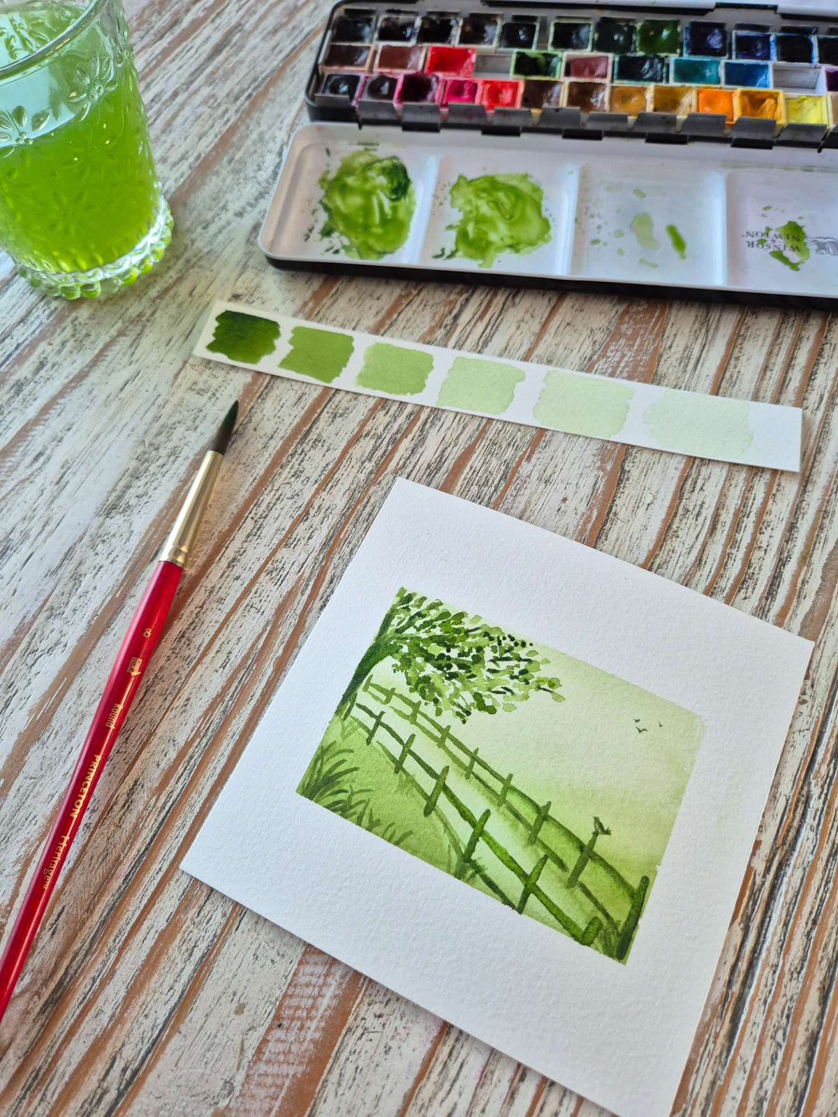 aquarelle monochrome vert représentant une campagne